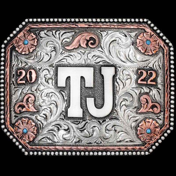 "Our Tularosa Belt Buckle captures the essence of the Southwest with its intricate German Silver scrollwork and Copper floral accents in each corner. This buckle is crafted with a German Silver beaded edge, a Copper inner edge and Copper overlays.


